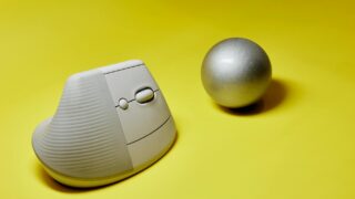 modern vertical mouse and ball on yellow background